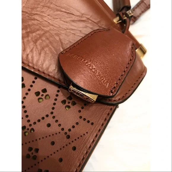 BCBGMaxAzria laser cut trapeze handbag
